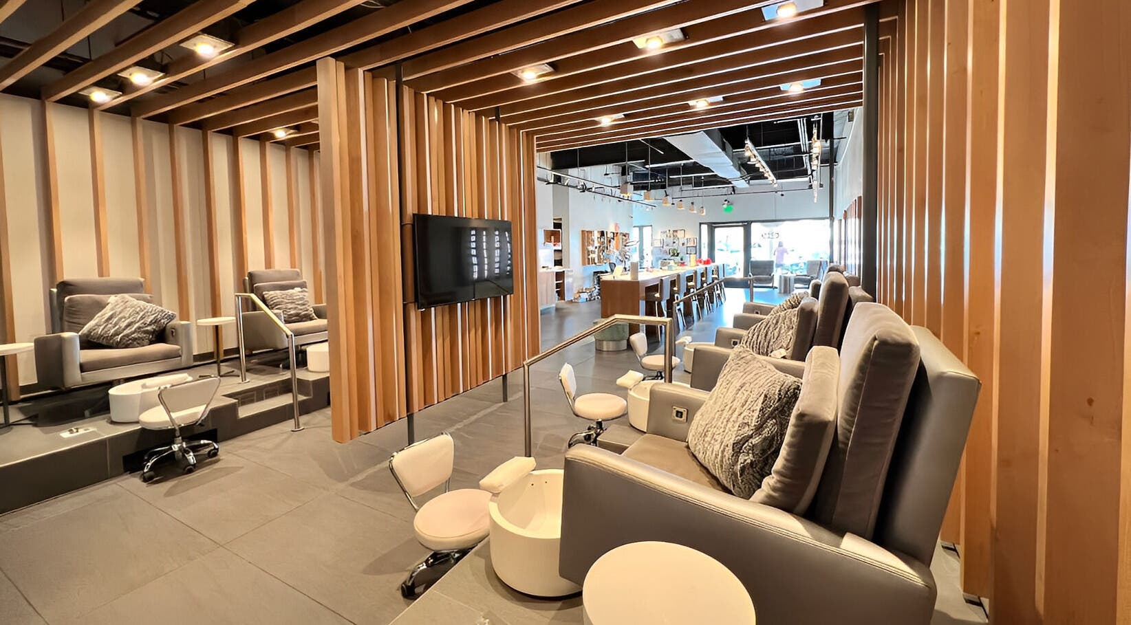 Luxury nail salon interior at It's Nailsdate in Scottsdale, Arizona. Cozy seating with plush chairs and modern decor.