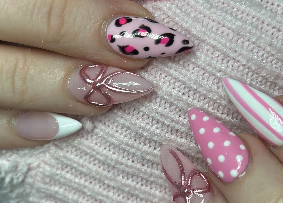 Stylish nail art with pink and white designs at The Nail And Beauty Lounge, North Adelaide, South Australia, AU.