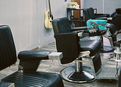 Modern barber chairs at Hombre Barbers (Tampines), Singapore, Singapore, SG, offering a premium grooming experience.