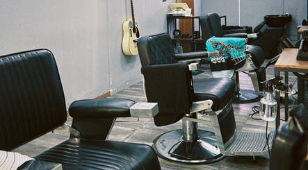 Modern barber chairs at Hombre Barbers (Tampines), Singapore, Singapore, SG, offering a premium grooming experience.