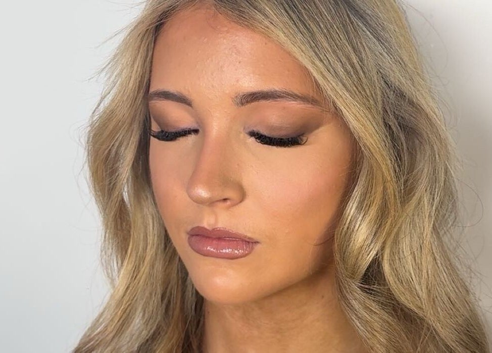 Close-up of a woman with flawless makeup by Veloura Artistry, Flinders, New South Wales, AU.