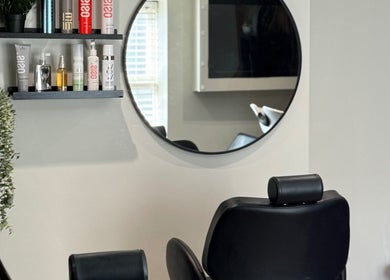 Elegant salon interior at tweakhair, Fakenham, England, GB showcasing stylish decor and modern furniture.