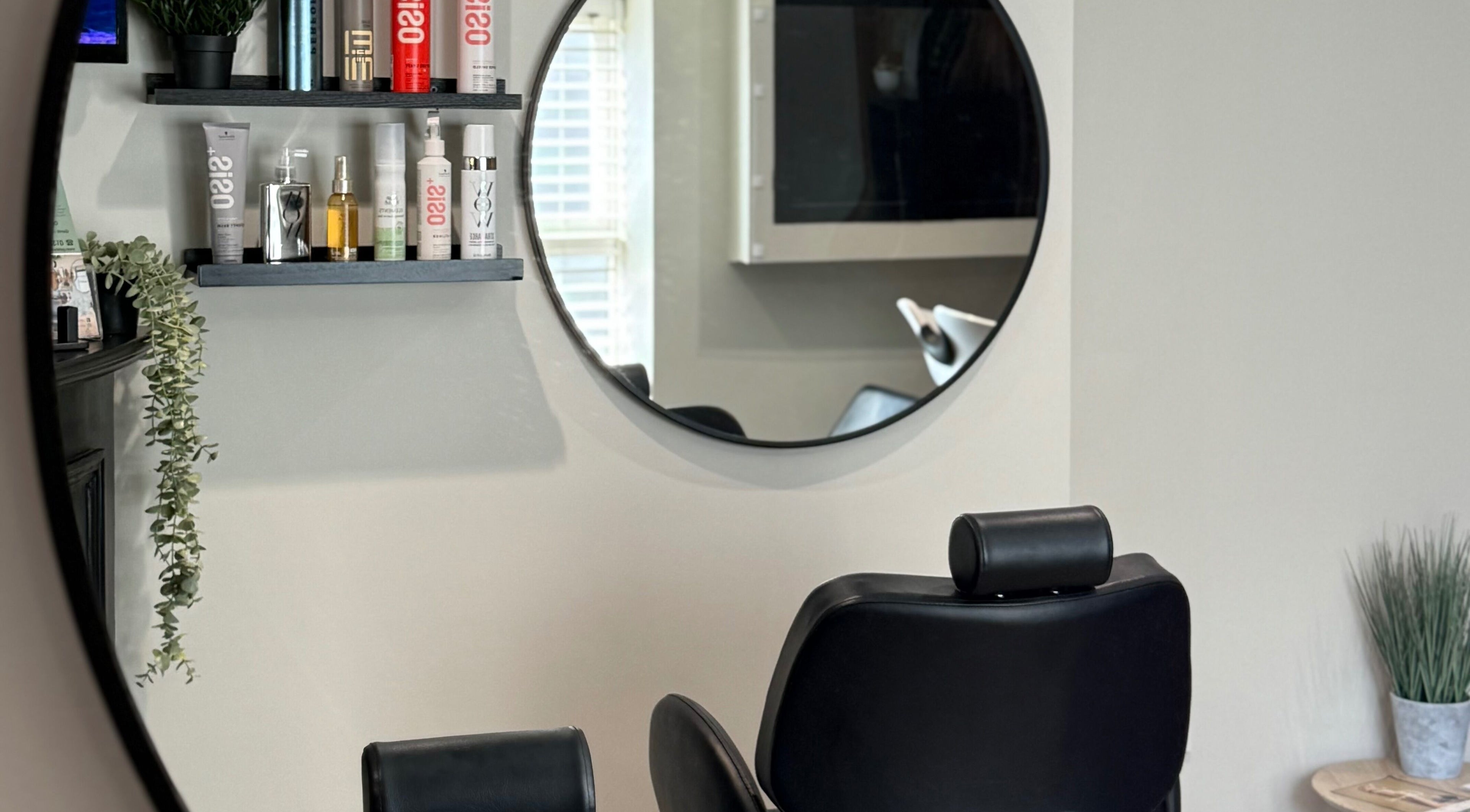 Elegant salon interior at tweakhair, Fakenham, England, GB showcasing stylish decor and modern furniture.
