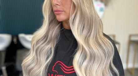Silky blonde hair styled in waves at Kelly Griffiths Hair, Wrexham, Wales, GB.