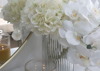 Elegant white flowers and candles at LUXE skincare, Melbourne, Victoria, AU.