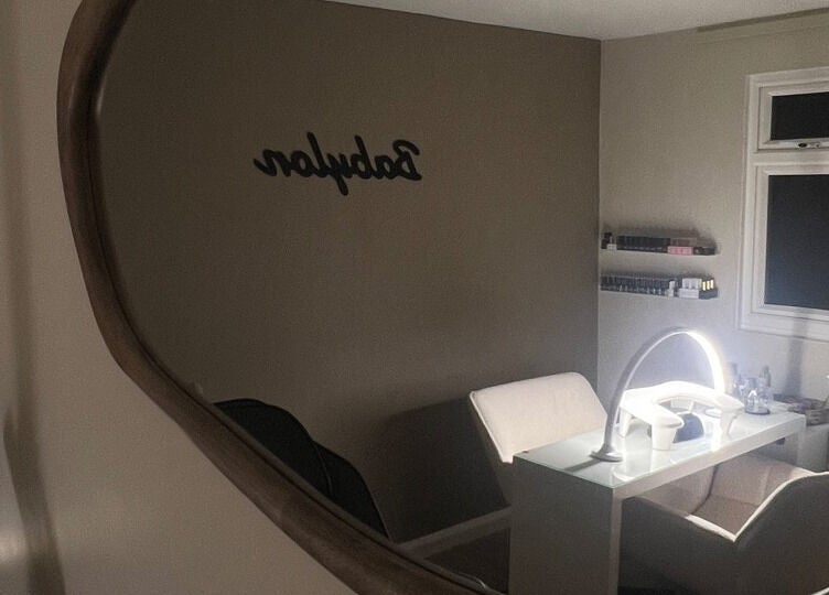Cozy nail salon in Babylon, Ramsey, England, GB, featuring chic lighting and modern decor.