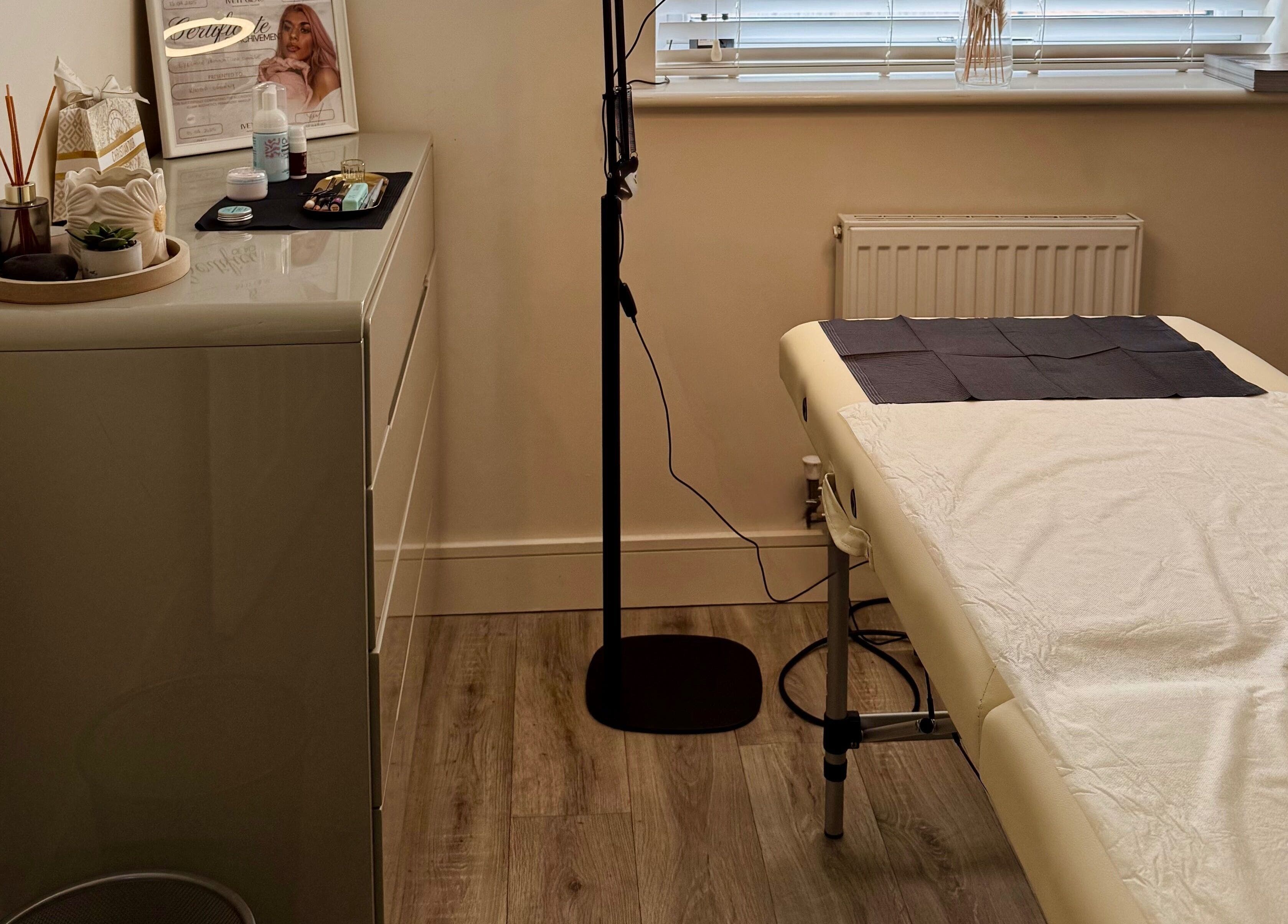 Cozy treatment room at Studio K. Beauty By Kinga in Houghton Regis, England, GB, featuring a massage bed.