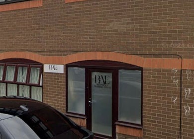 Street view of Glossed By Francesca venue in Luton, England, GB featuring a brick facade and large windows.