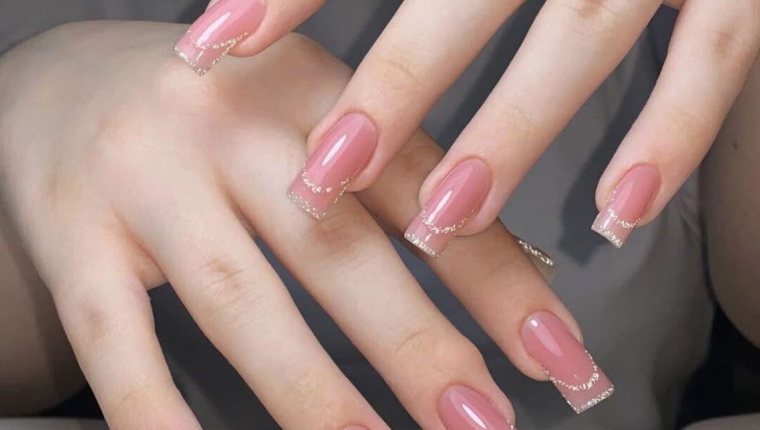 Elegant pink nails with glitter at La Rosé Des Beauté Nails in Randburg, Gauteng, ZA.