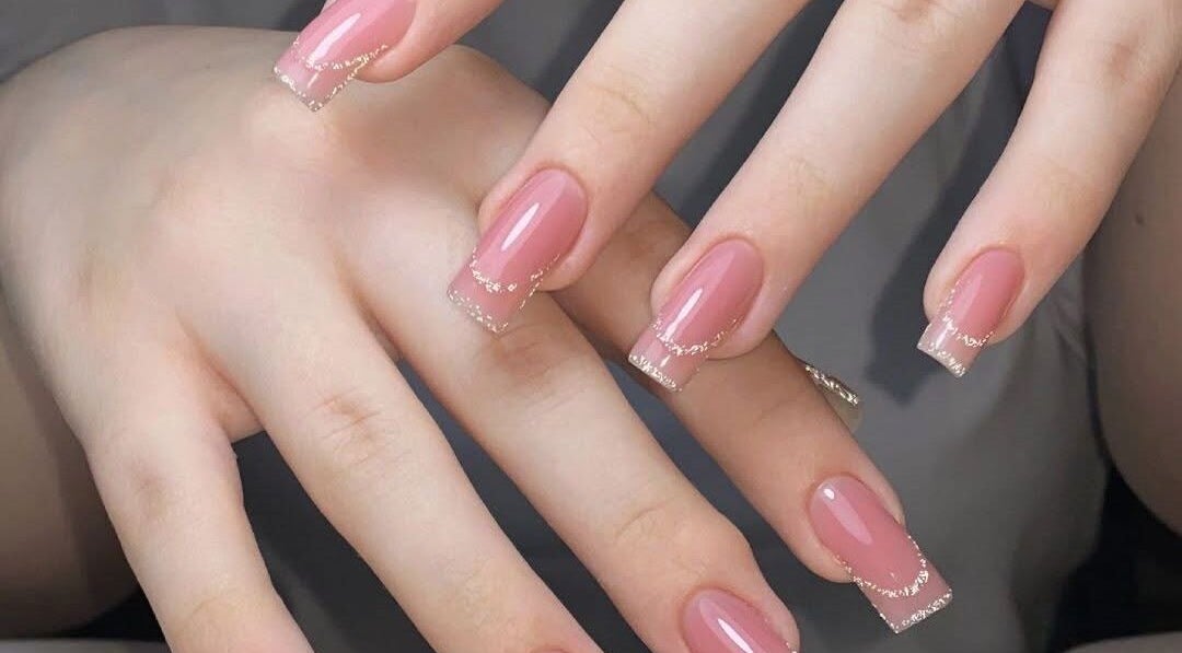 Elegant pink nails with glitter at La Rosé Des Beauté Nails in Randburg, Gauteng, ZA.