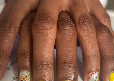 Bright nail art at La Rosé Des Beauté Nails, Randburg, Gauteng, ZA. Glitter, yellow polish, detailed designs.