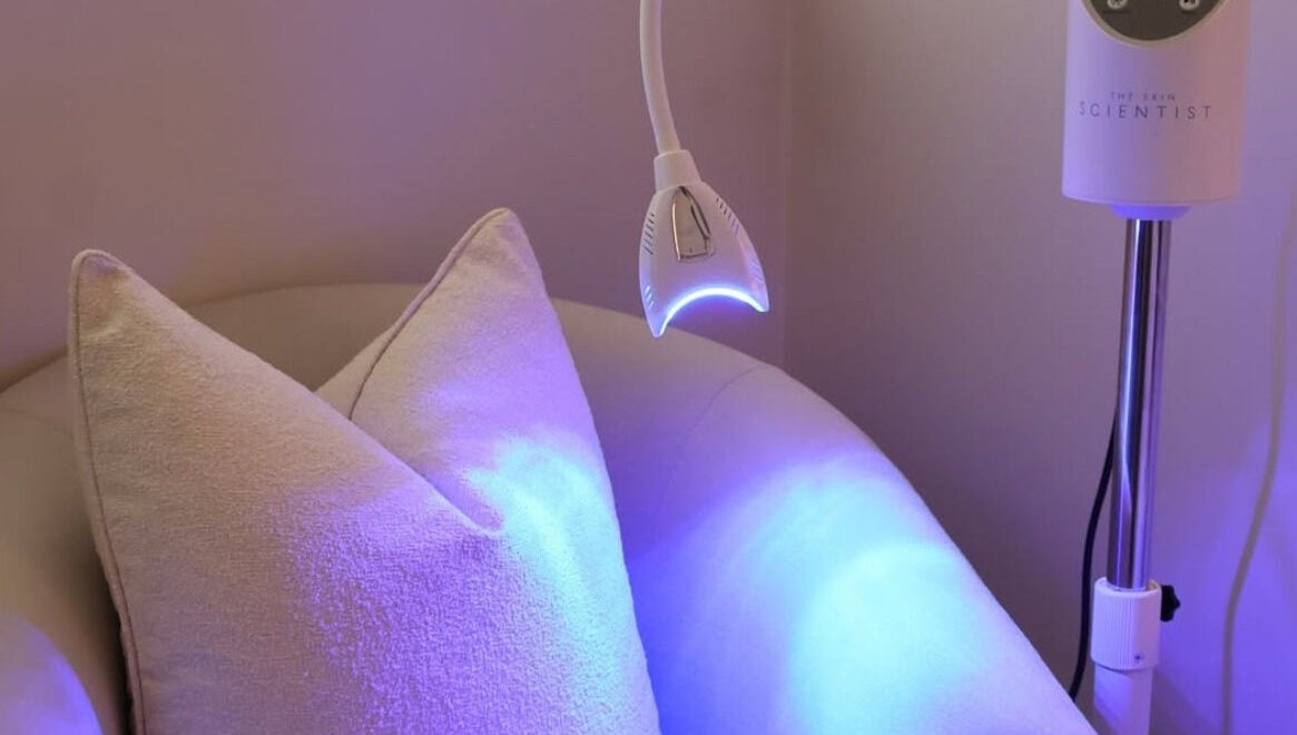 Relaxing chair with LED therapy lamp at The Beauty Scientist, Hurstville, New South Wales, AU.