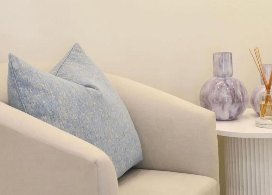 Elegant seating with blue pillow at The Beauty Scientist, Hurstville, New South Wales, AU enhances relaxation.