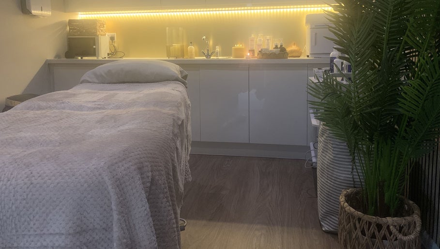 Tranquil treatment room at Repton Revive with cozy bed and ambient lighting in Repton, England, GB.