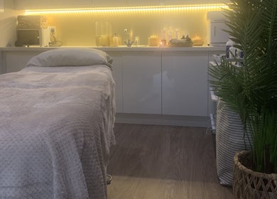 Tranquil treatment room at Repton Revive with cozy bed and ambient lighting in Repton, England, GB.