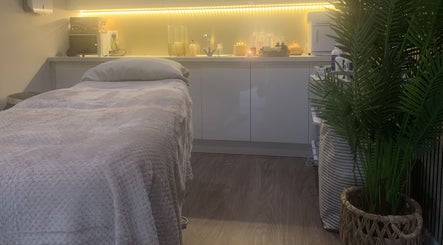 Tranquil treatment room at Repton Revive with cozy bed and ambient lighting in Repton, England, GB.