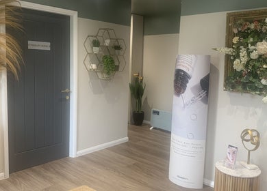 Elegant entrance to therapy room at Repton Revive, Repton, England, GB with floral decor and modern accents.