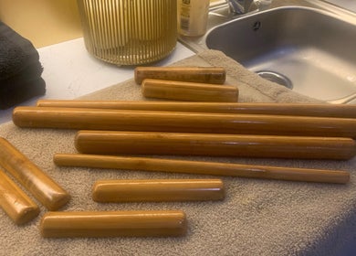 Bamboo massage tools on towels at Repton Revive, Repton, England, GB. Enhance relaxation and wellness.