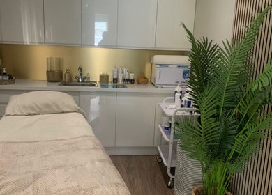 Peaceful treatment room at Repton Revive, Repton, England, GB, showcasing a plush bed and soothing decor.