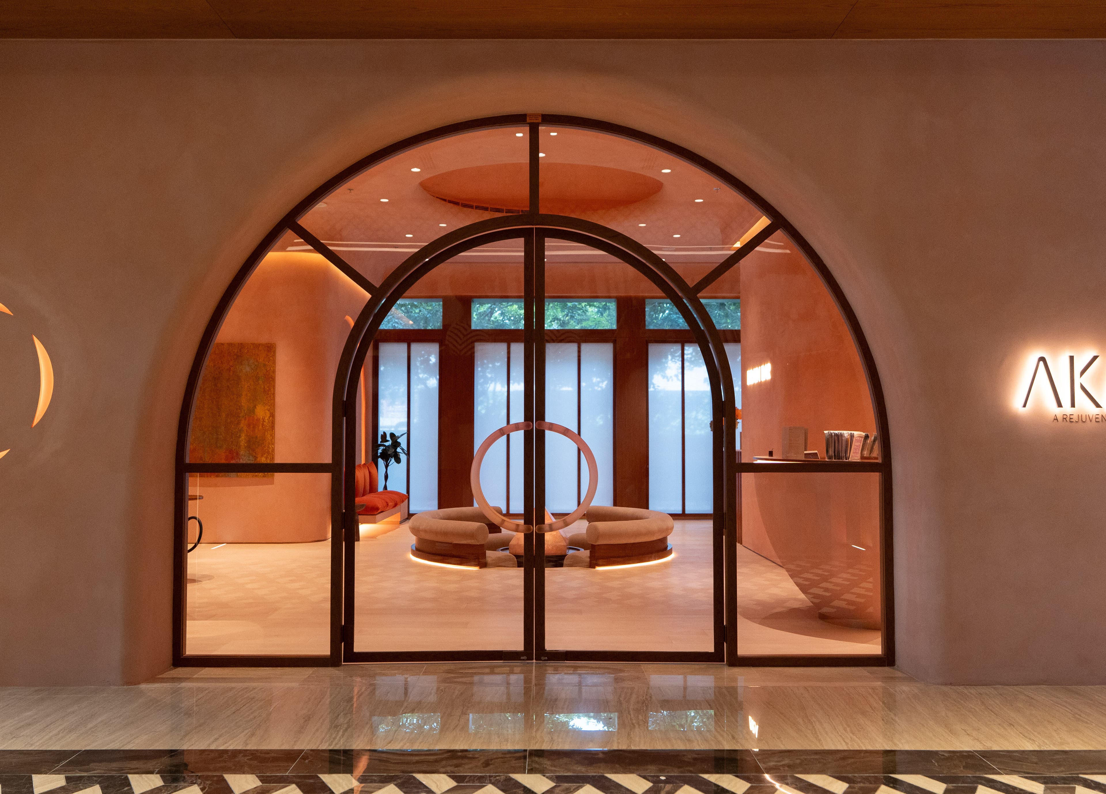 Stylish entrance of AKARI in District, دبي, AE showcasing modern design and warm lighting.