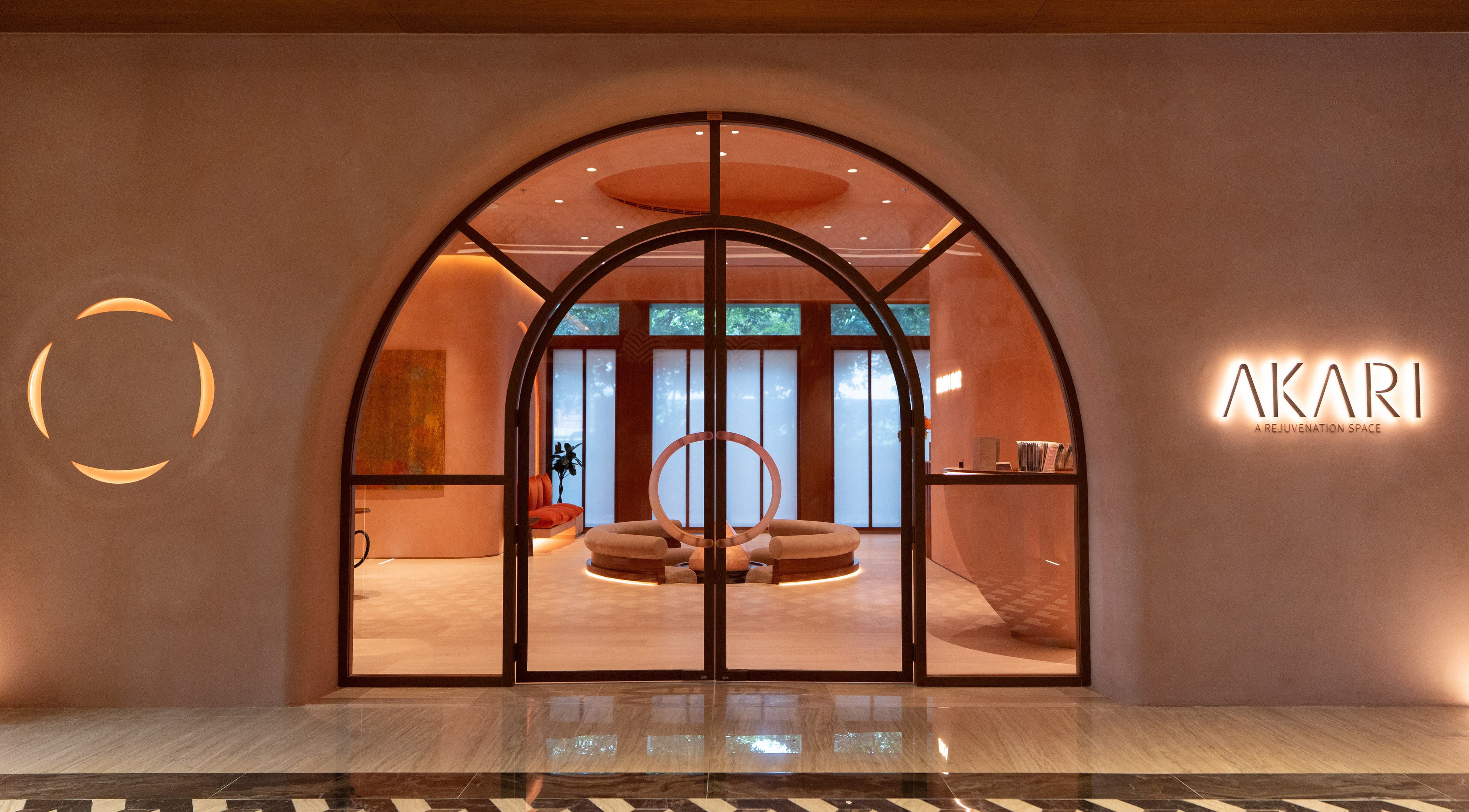 Stylish entrance of AKARI in District, دبي, AE showcasing modern design and warm lighting.
