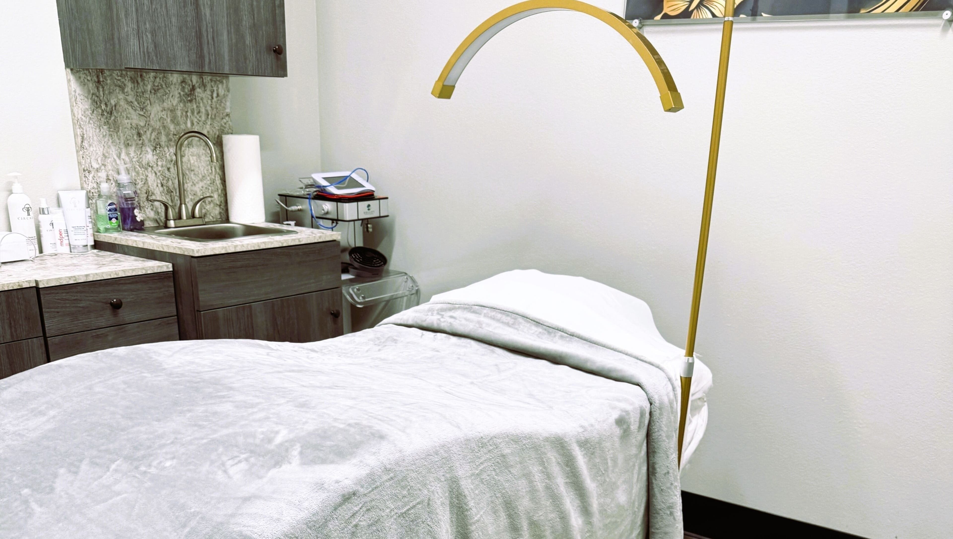 Serenity Aesthetics & Spa in Charlotte, North Carolina, US offers a tranquil treatment room with a comfortable bed.