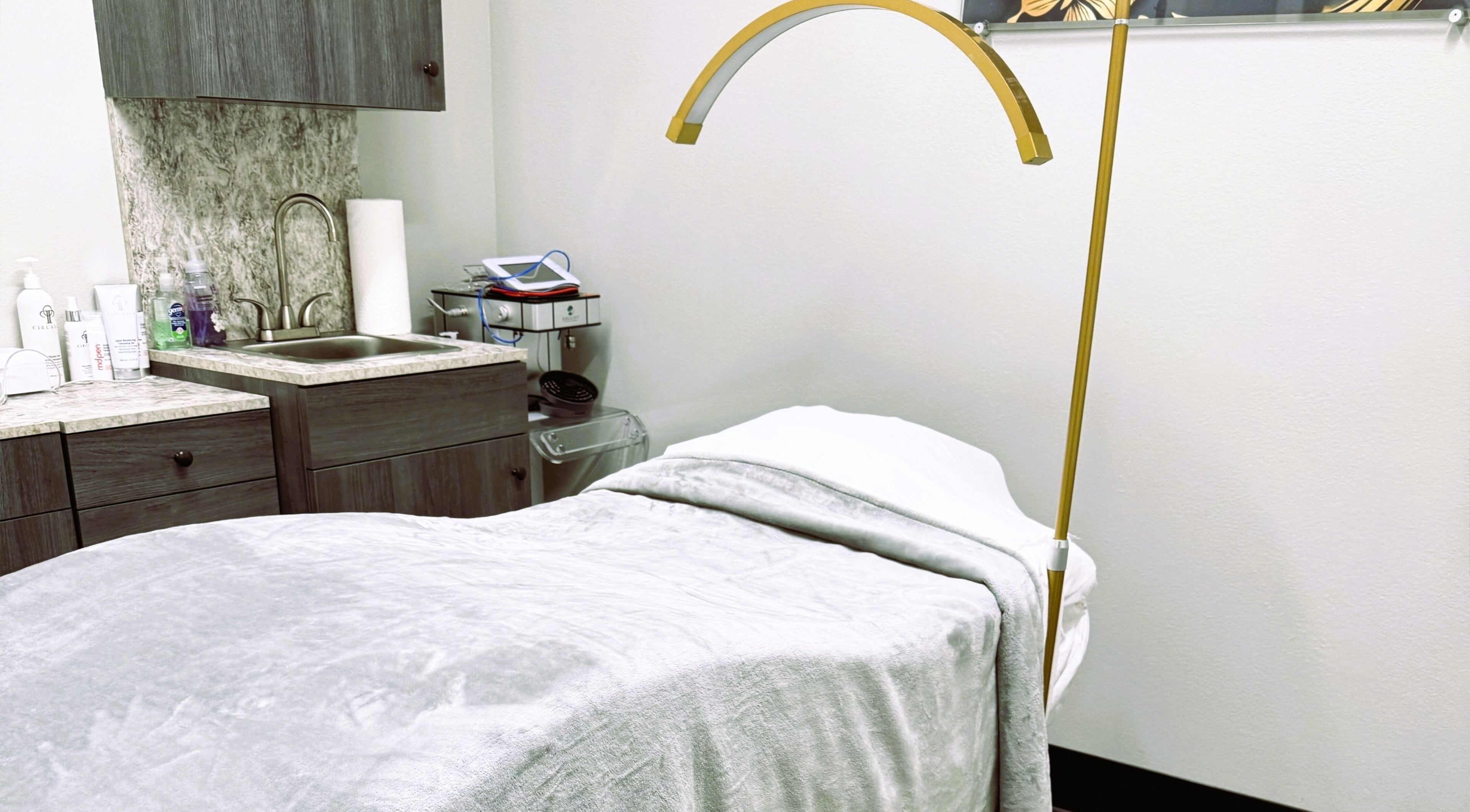 Serenity Aesthetics & Spa in Charlotte, North Carolina, US offers a tranquil treatment room with a comfortable bed.