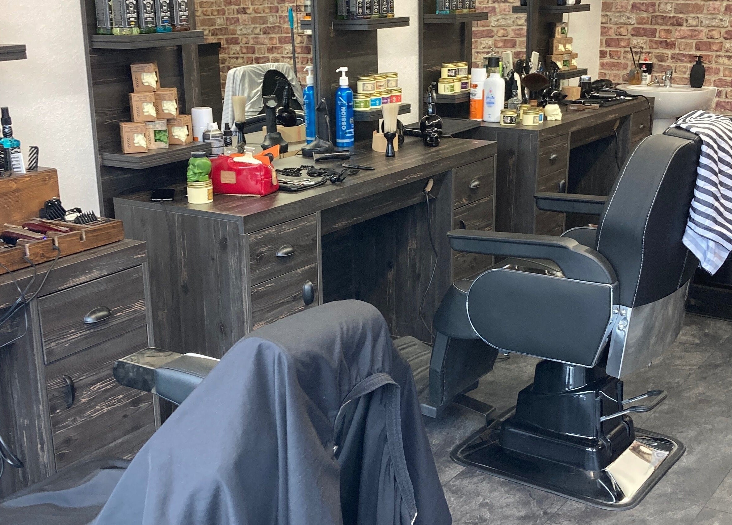 Modern barbershop interior at Cutcorner, County Kildare, IE showcasing sleek barber chairs and grooming products.