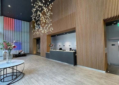 Modern lobby at JZ Nailed It, Croydon, England, GB with chic lighting and wood accents.