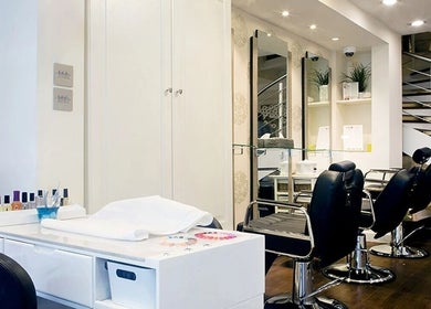 Modern beauty salon at Anya Spa@Angel with sleek chairs and manicure station. London, England, GB.