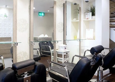 Chic styling area at Anya Spa@Angel, London, England, GB with modern chairs and sleek mirrors.