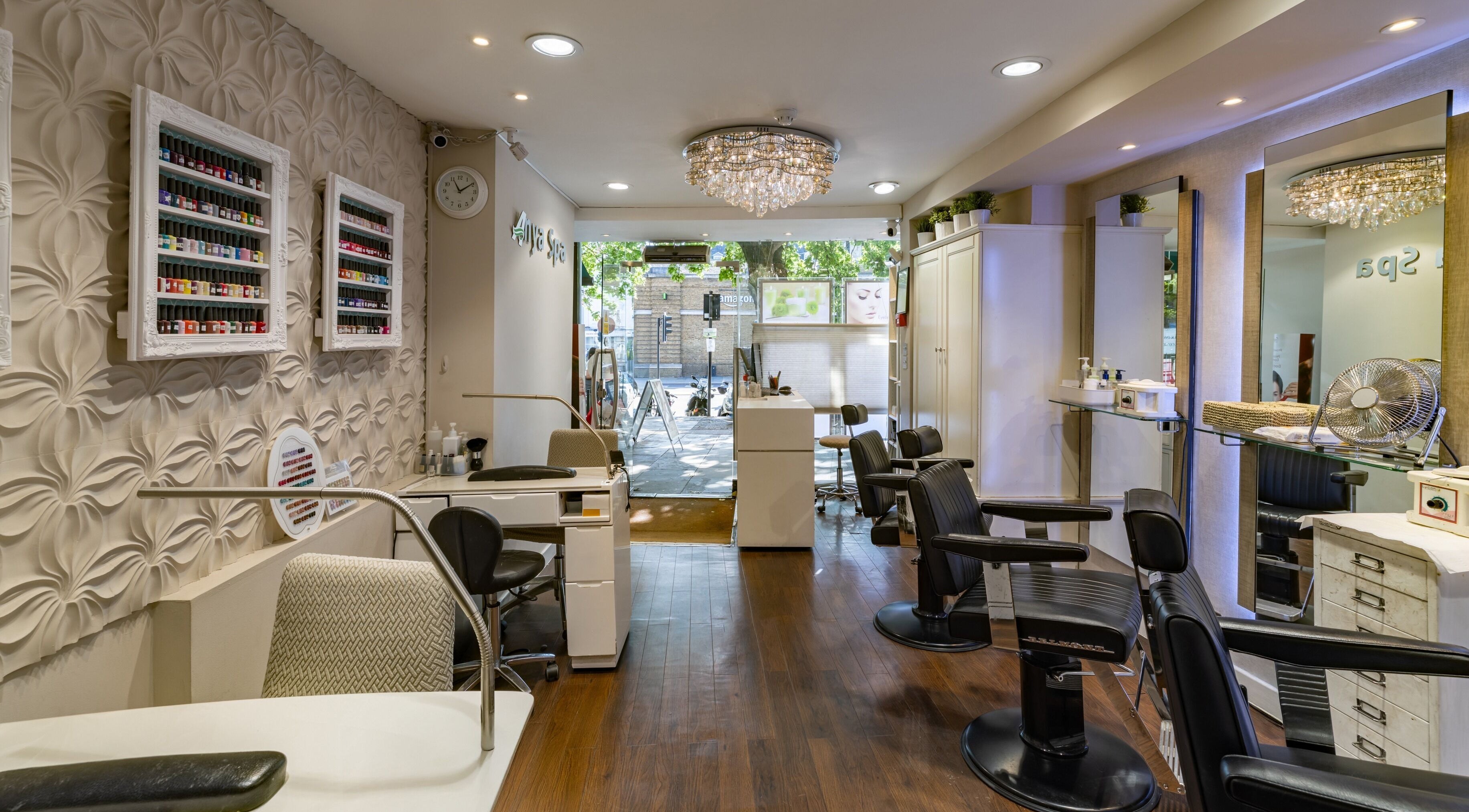 Interior of Anya Spa@Angel in London, England, GB with stylish decor and nail polish display.