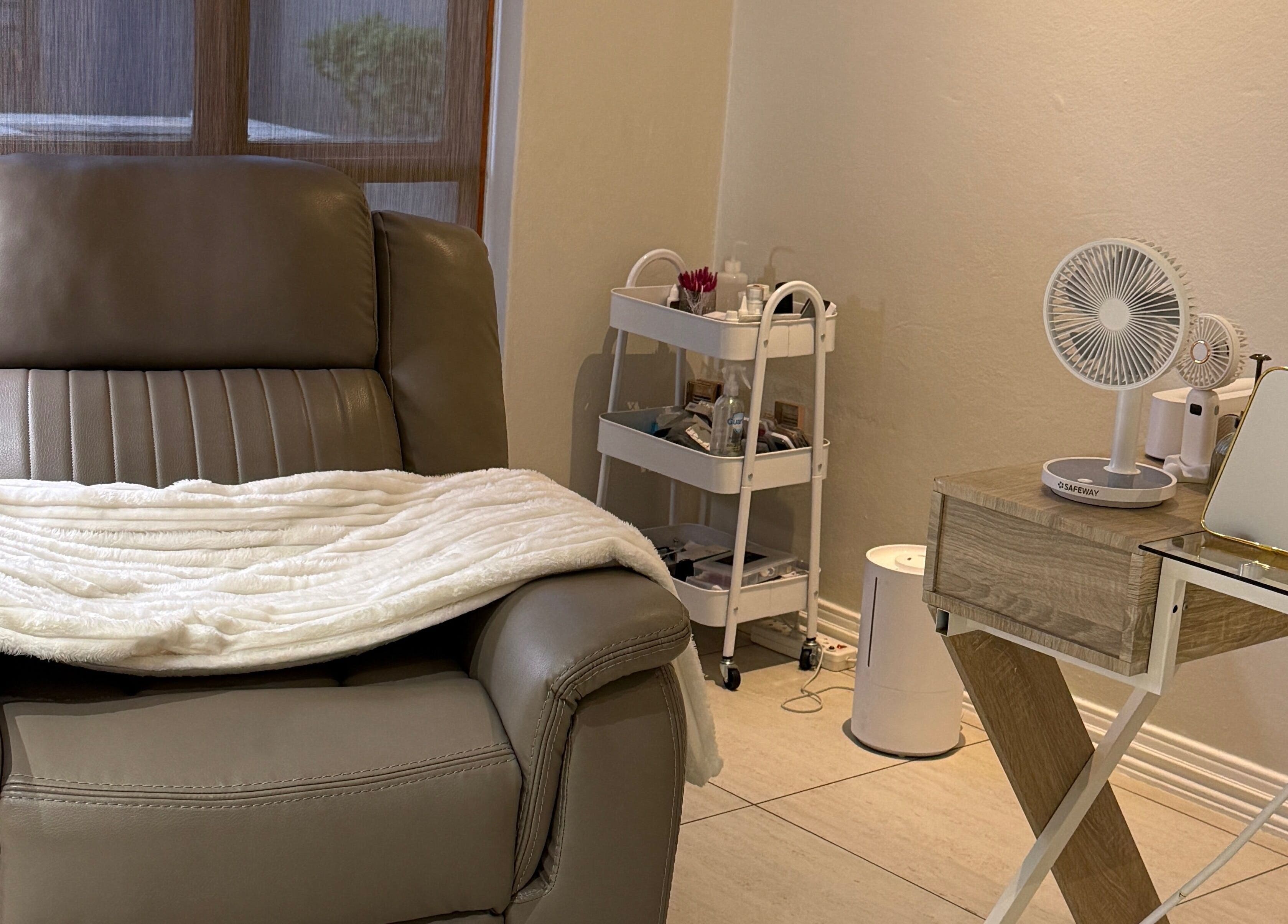 Relaxing leather chair setup at Melanin Aesthetics SA, Germiston, Gauteng, ZA with side table and beauty essentials.