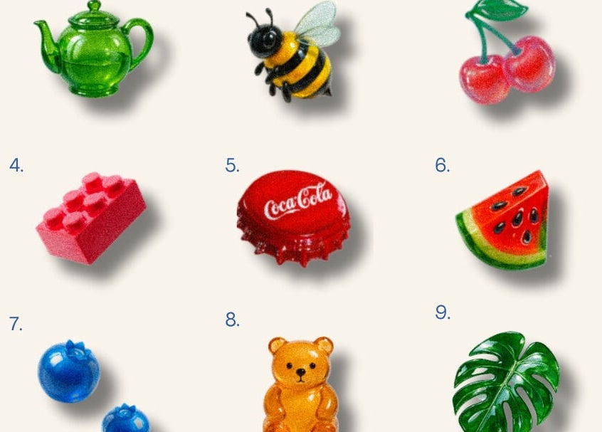 Vibrant trinkets displayed at Coolbabatattoo, New York, US, featuring a teapot, bee, and more.