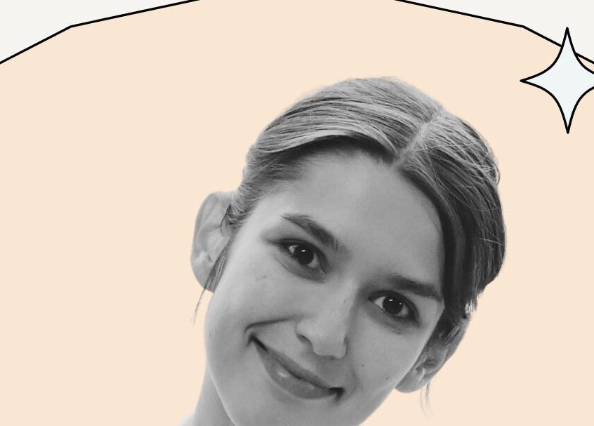 A smiling individual with a creative background at Coolbabatattoo, New York, US showcases artistic beauty.