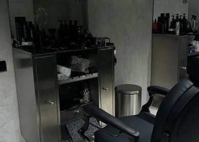 Sleek barbershop interior at MERAK BARBERSHOP, Jeddah, Makkah Province, SA with a modern chair and grooming products.