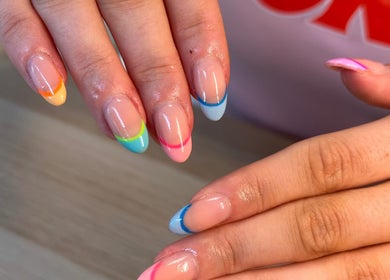 Vibrant rainbow French nails at Nails By Katie, Coleraine, Northern Ireland, GB.