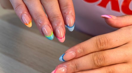 Vibrant rainbow French nails at Nails By Katie, Coleraine, Northern Ireland, GB.