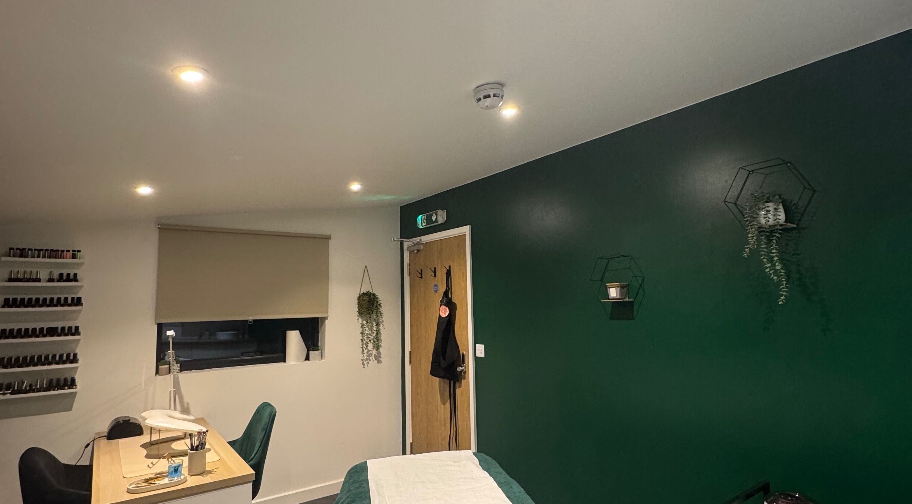 Calm and modern treatment room at SH Enhancements, Somerton, England, GB, featuring elegant decor.