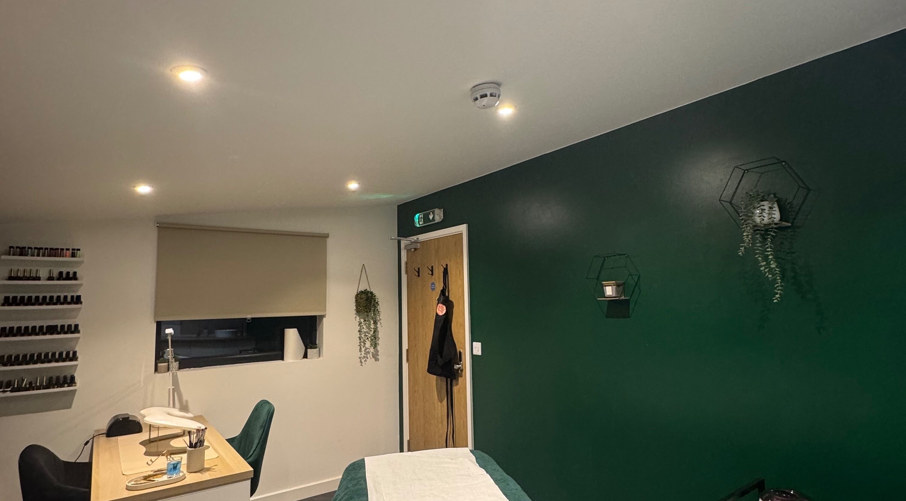 Calm and modern treatment room at SH Enhancements, Somerton, England, GB, featuring elegant decor.