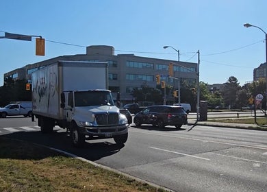 City view near Medi Hair Loss & Scalp Clinic Toronto on a busy street in Toronto, Ontario, CA.
