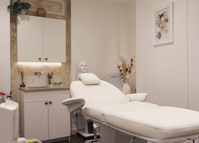 Tranquil treatment room at SkinWell Aesthetics Boutique, London, England, GB with a plush white therapy bed.
