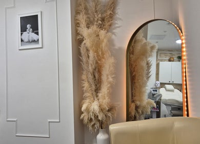 Chic decor and mirror at SkinWell Aesthetics Boutique in London, England, GB, showcasing elegance and luxury.
