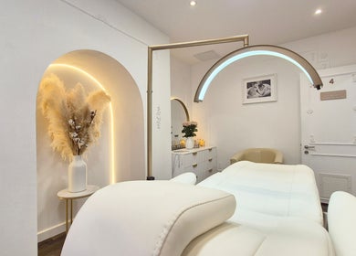 Luxurious treatment room at Skin Well Aesthetics Boutique, London, England, GB, featuring elegant decor and lighting.