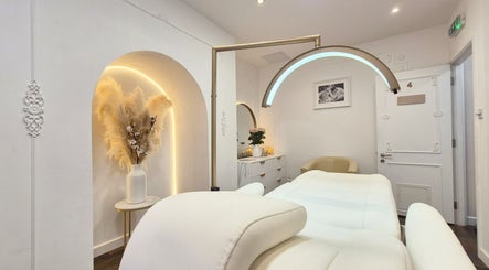 Luxurious treatment room at Skin Well Aesthetics Boutique, London, England, GB, featuring elegant decor and lighting.