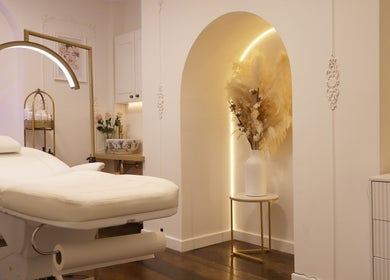 Elegant treatment room at Skin Well Aesthetics Boutique, London, England, GB, featuring a luxurious spa bed.