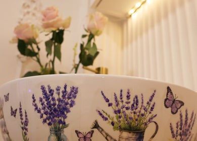 Elegant floral basin at Skin Well Aesthetics Boutique, London, England, GB, enhancing tranquil ambiance.