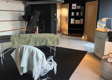 Relaxing massage room at The Recovery Room, Doncaster, England, GB, featuring a massage table and calming decor.