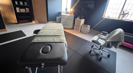 Massage room at The Recovery Room, Doncaster, England, GB, featuring a treatment table and soft lighting.