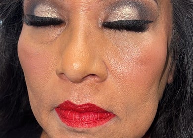 Elegant makeup with bold red lips and shimmering eyeshadow at Browsbybre, Upland, California, US.